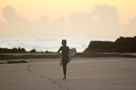 Young surfer surfing at sunrise/dawn, a Sports & Recreation Photo by elyse.lu