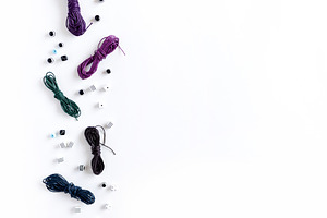 Scattered waxed cords and beads