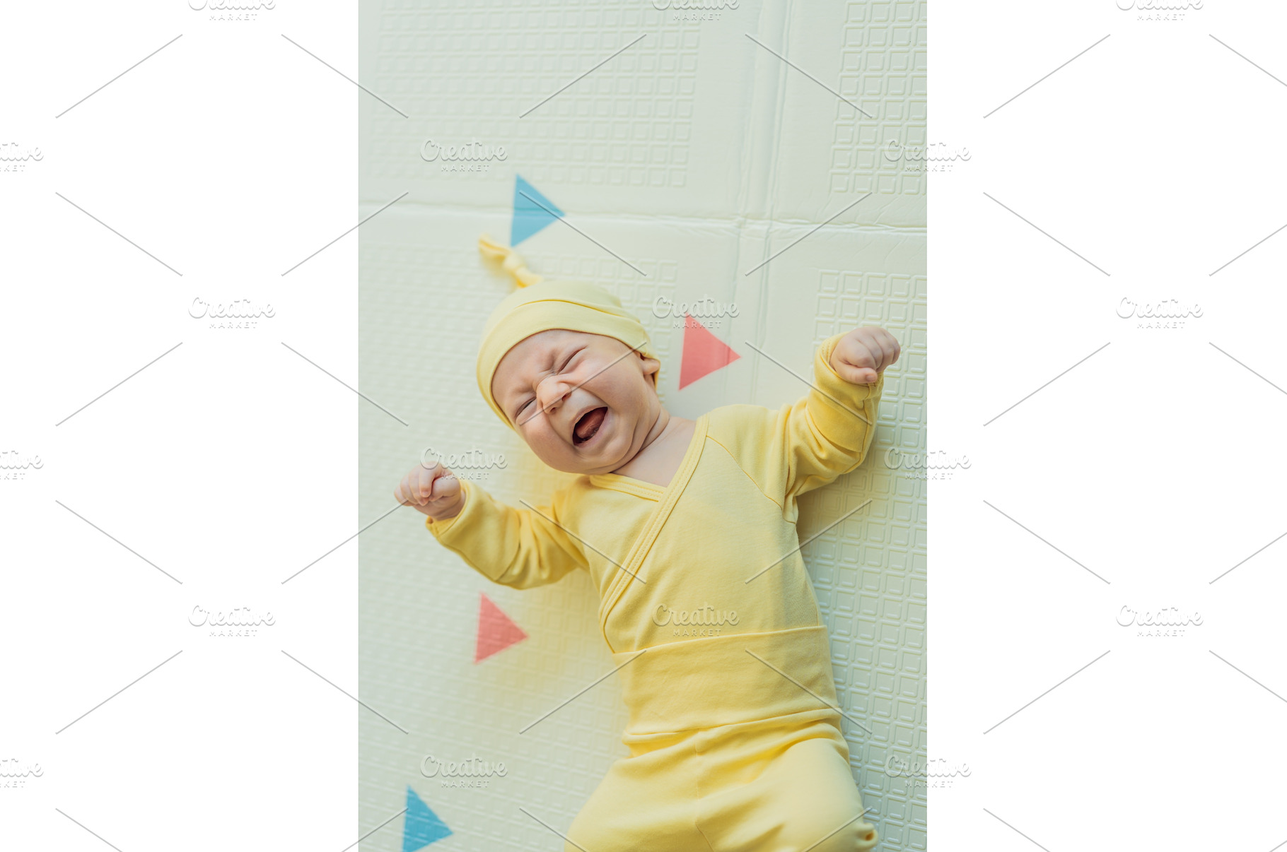 Adorable baby in a yellow hat lying, a Person Photo by Elizaveta Galitskaya