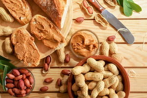 Breakfast with homemade peanut butter on wooden table outside, a Food & Drink Photo by Davizro's Market