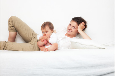 Mother playing with baby on white, a Person Photo by sborisov