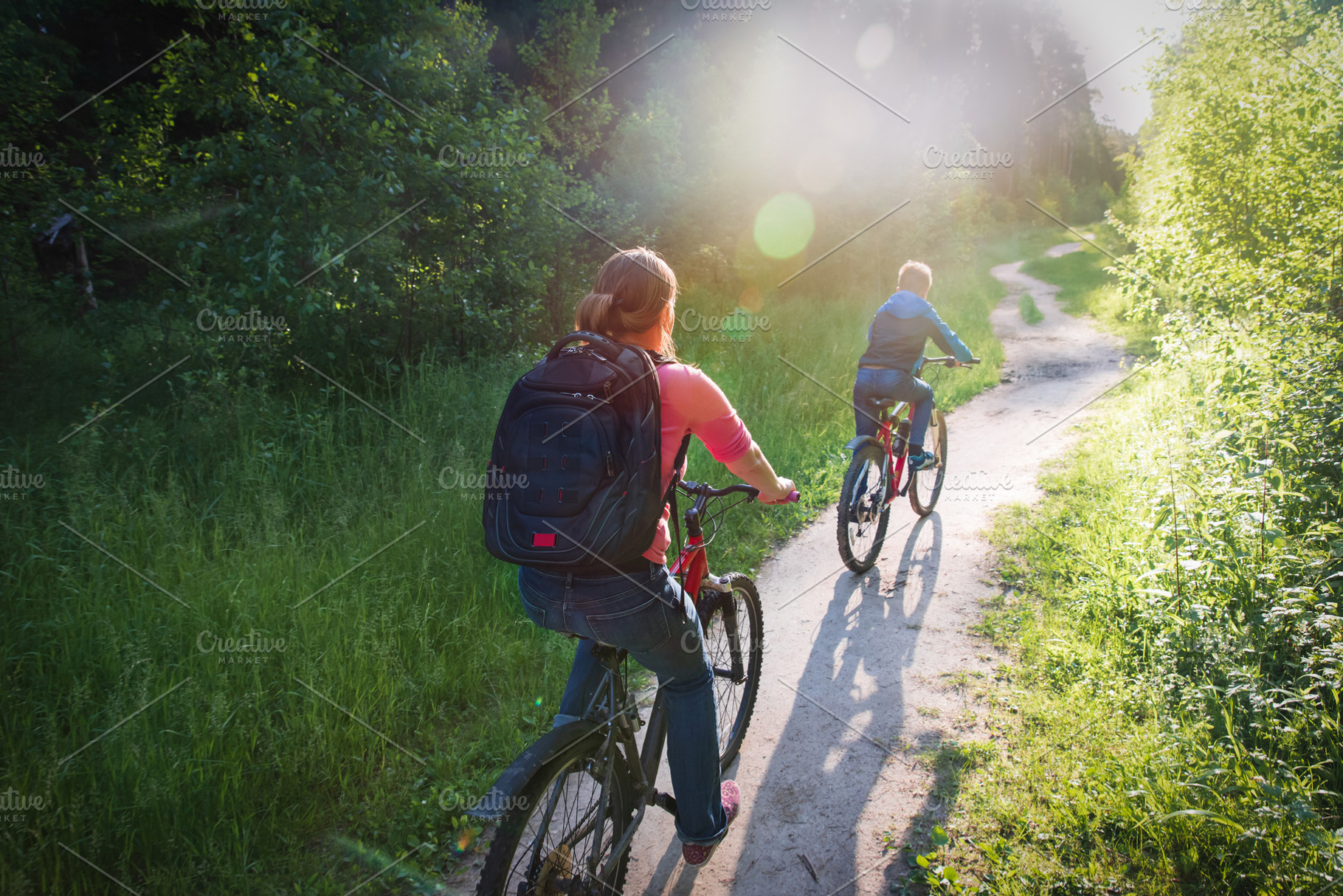 family riding bikes at sunset, a Person Photo by Nadezhda_Prokudina