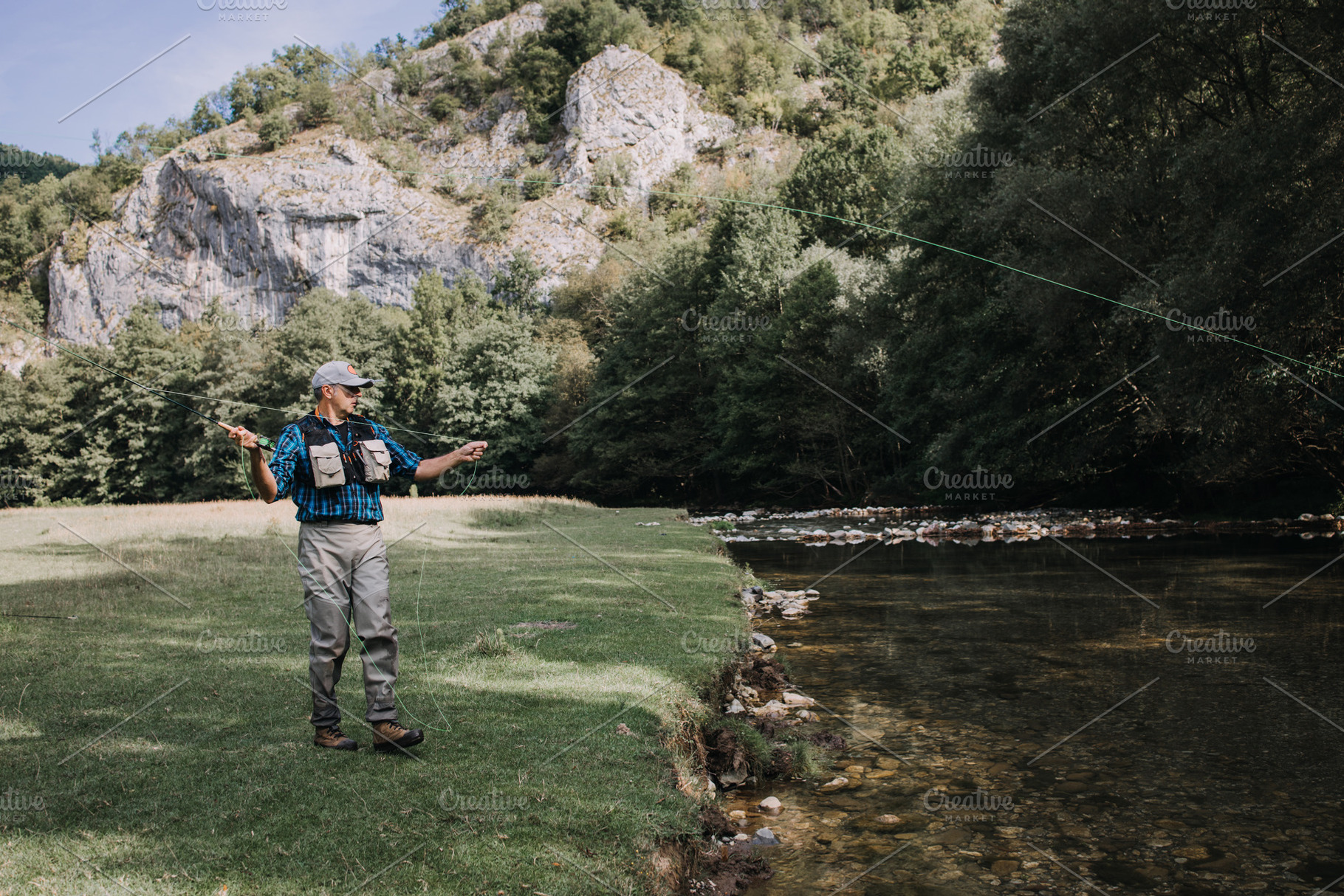 Fly fishing stock photo containing man and fly, a Person Photo by REDDOT Studio