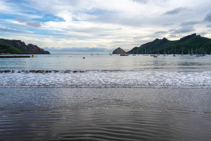 Taiohae Bay and black sand beach at sunset, Nuku Hiva, Marquesas, a Nature Photo by GoodGoods