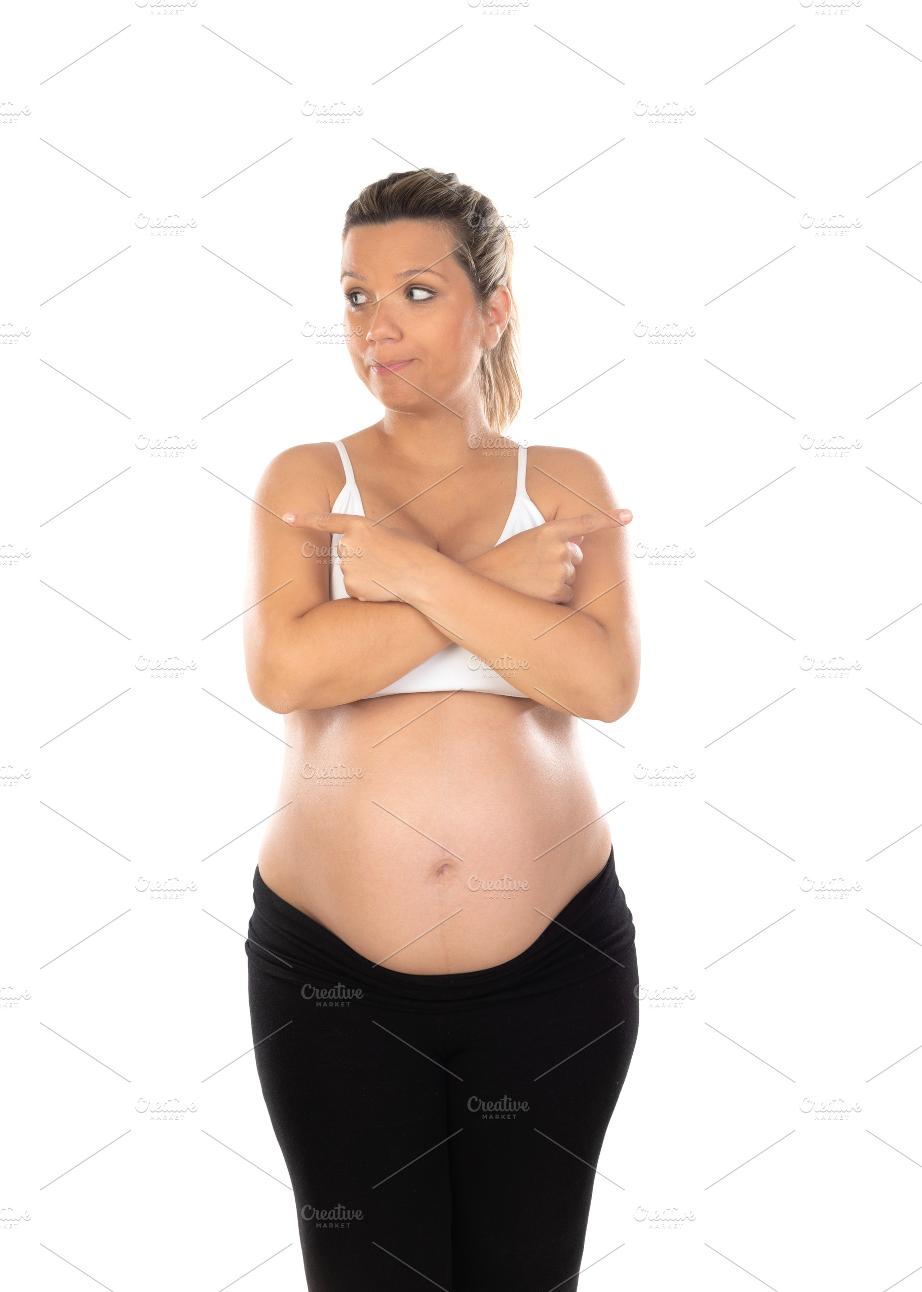 Image of pregnant woman touching her belly with hands, a Person Photo by José Manuel Gelpi