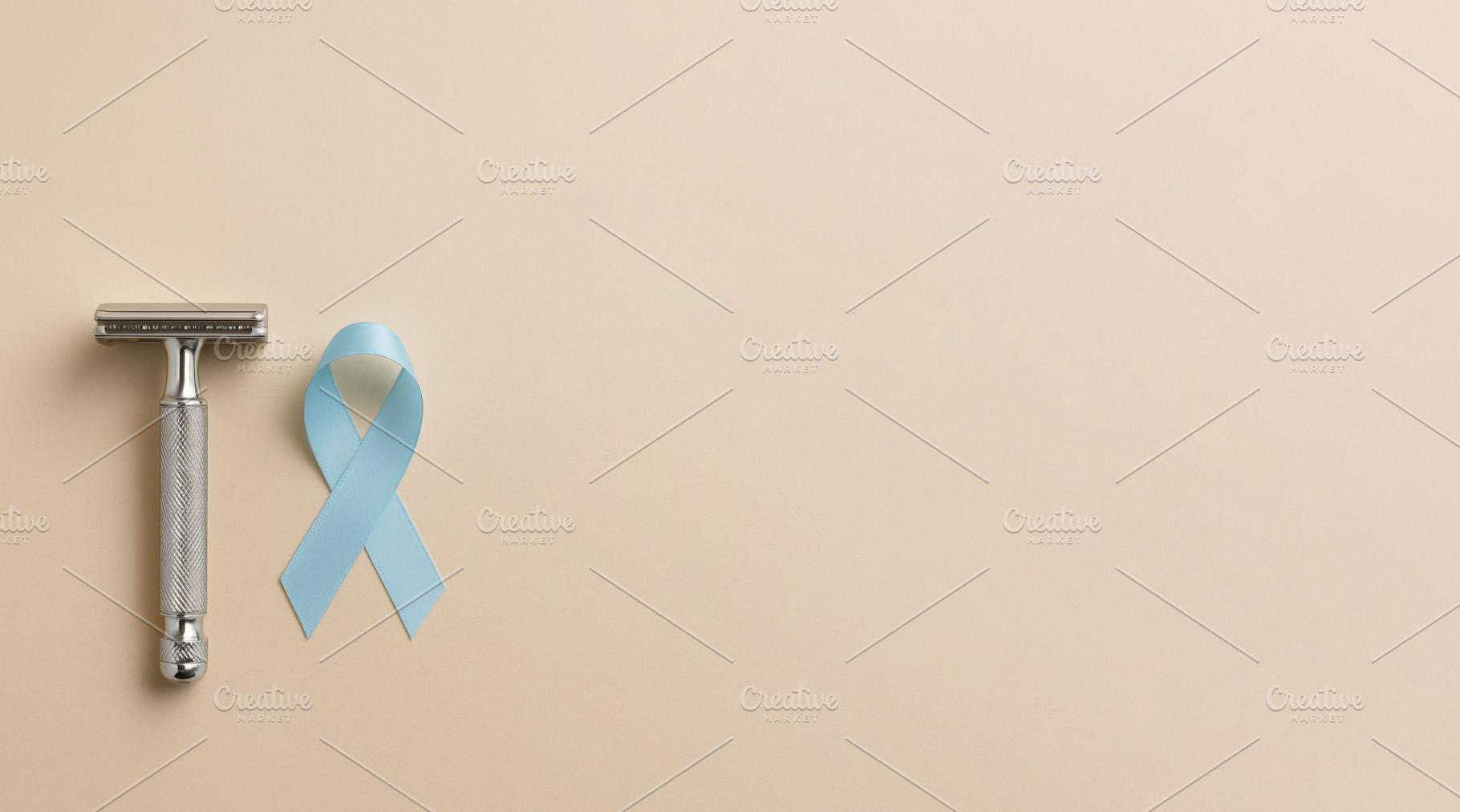 Men health awareness with blue ribbon and razor on beige backgro, a Photo by Dvoevnore photos