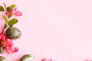 Easter flat lay. Stylish easter eggs and red flowers on pink bac, a Holiday Photo by Sonjachni