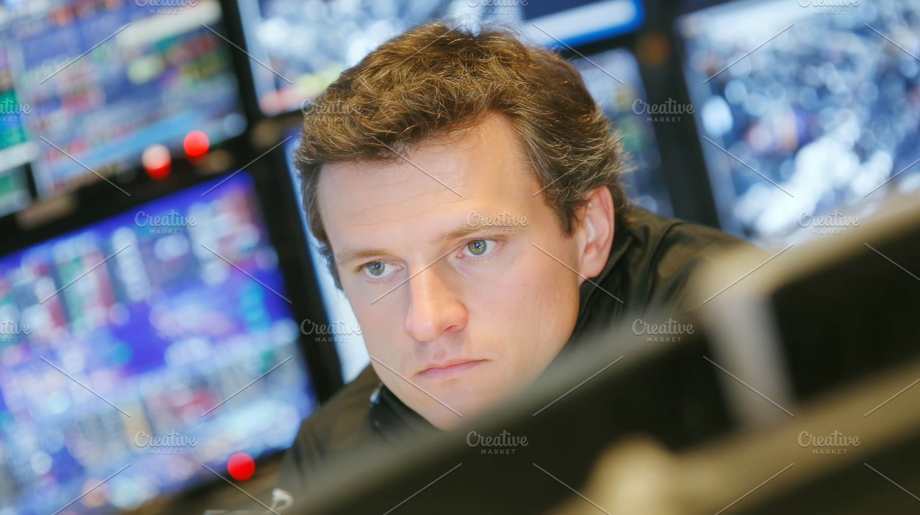 Focused trader monitoring stock market screens in a modern financial trading ro, a Photo by AS photostudio
