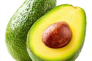 Fresh avocados cut in half on white background, a Food & Drink Photo by AlyaAnd