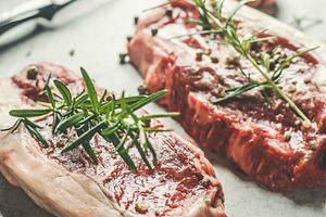 Close up of raw beef steak, a Food & Drink Photo by VICUSCHKA