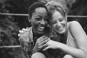 A cheerful lesbian couple stock photo containing affection and african, a Person Photo by rawpixel