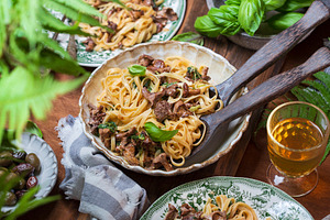 Plate of pasta with forest chanterel stock photo containing food and parsley