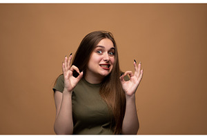 Young woman showing successful, a Person Photo by volodymyrshtun13795