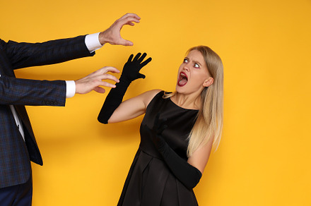 Concept of Halloween, young woman on yellow background, a Person Photo by AtlasStudio PRO
