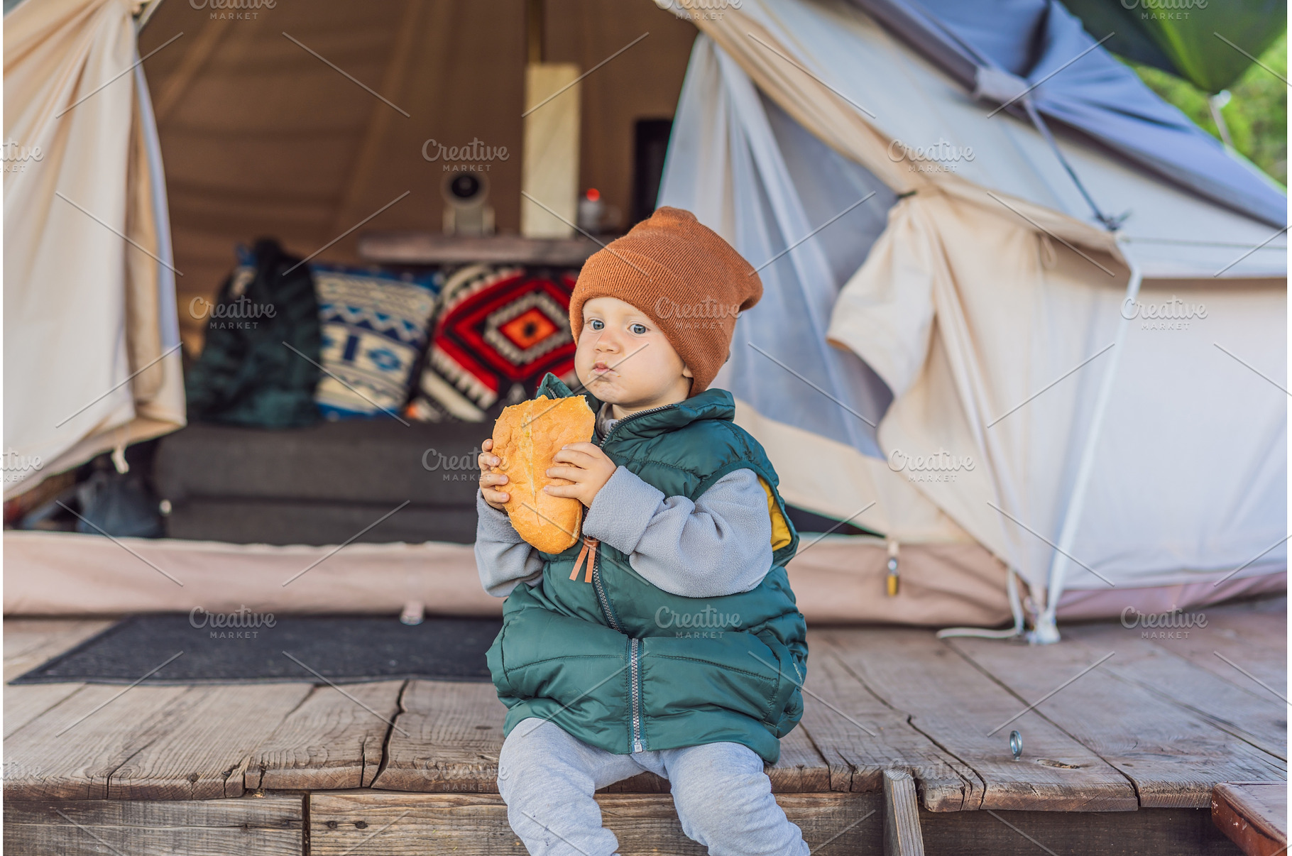 Young toddler tourist in a warm vest, a Person Photo by Elizaveta Galitskaya