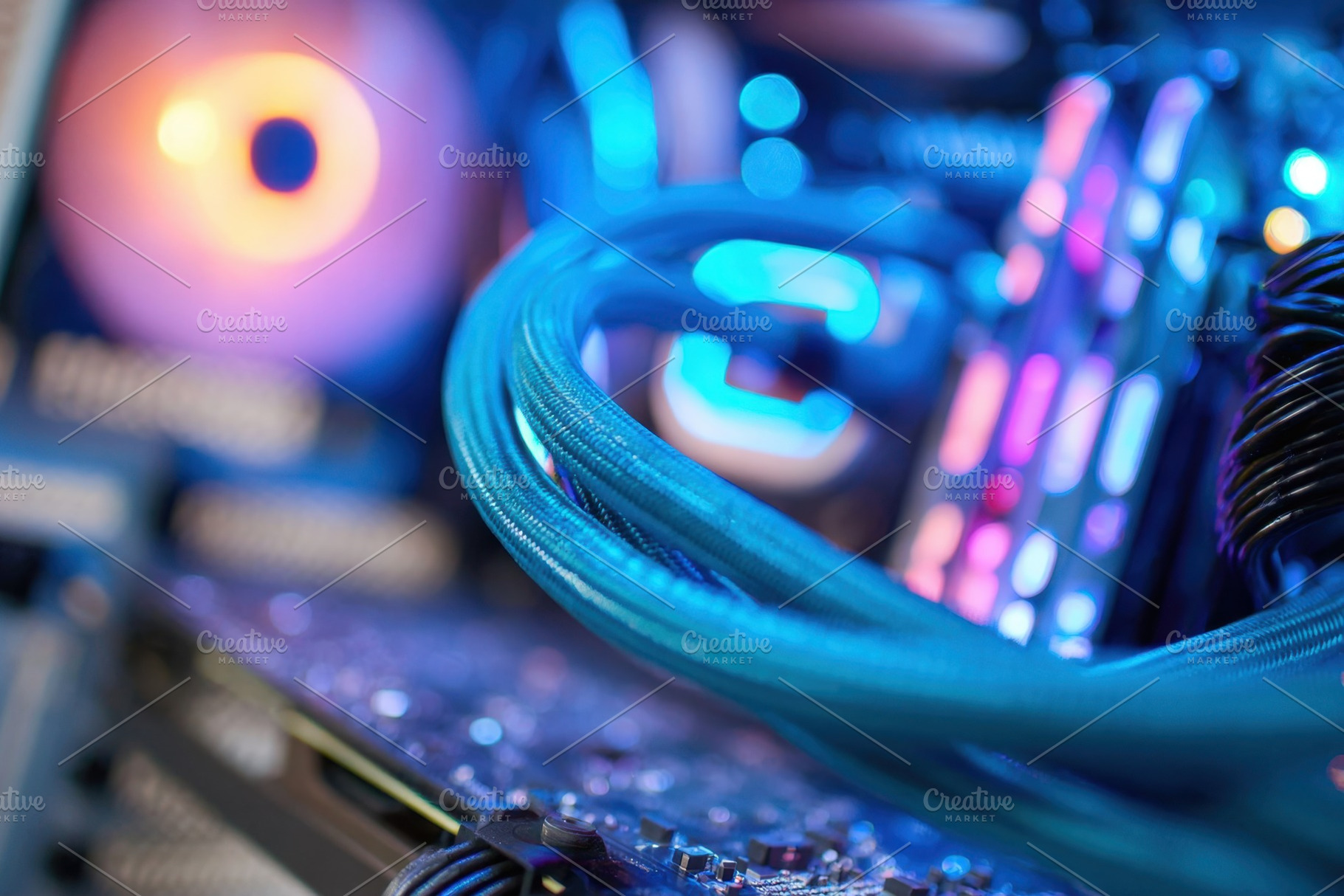 Close-up of a colorful computer motherboard, a Technology Photo by AlyaAnd