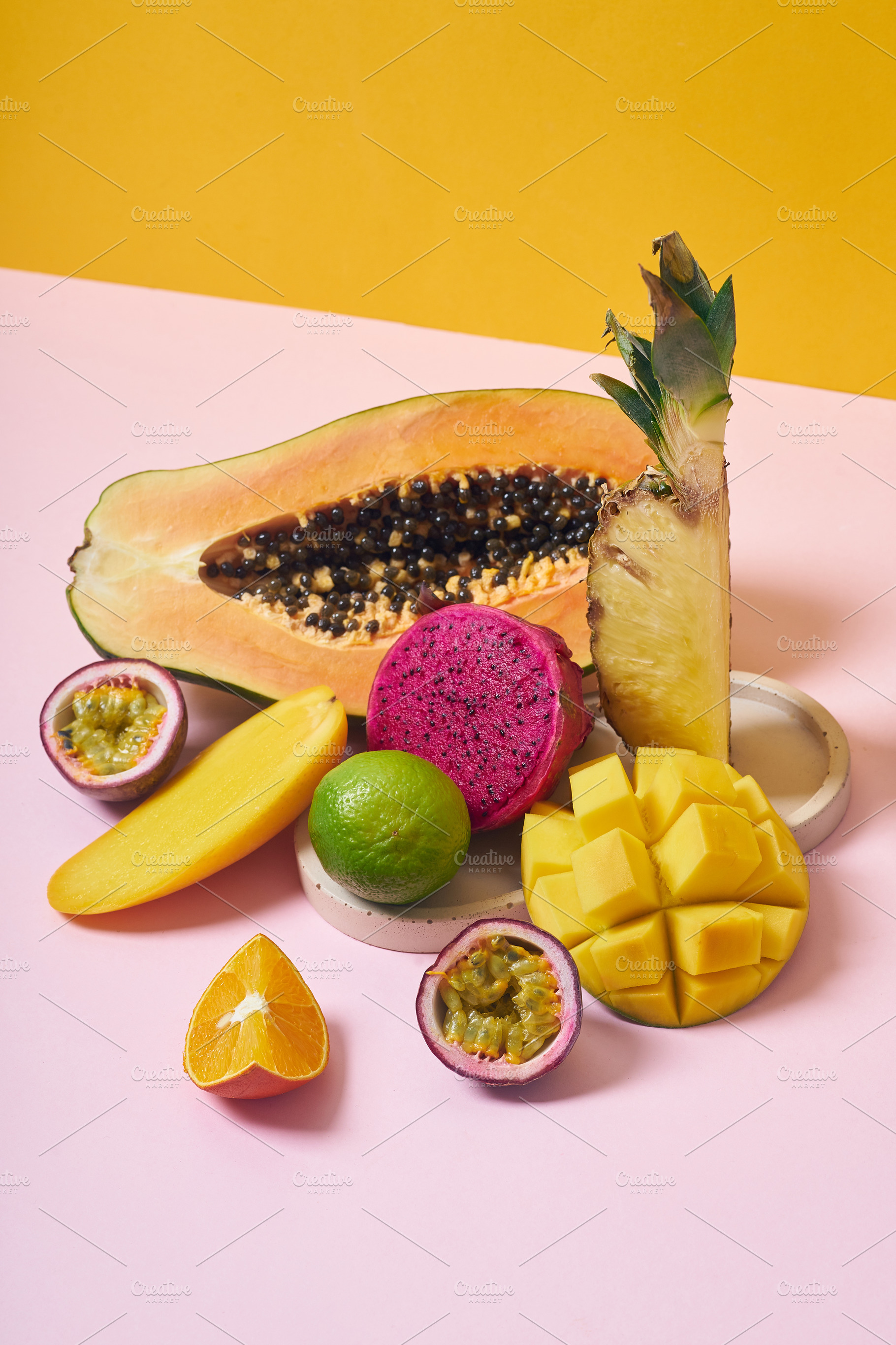 Tropical fruits variety on a colorful background. Side view with, a Food & Drink Photo by Asya Nurullina