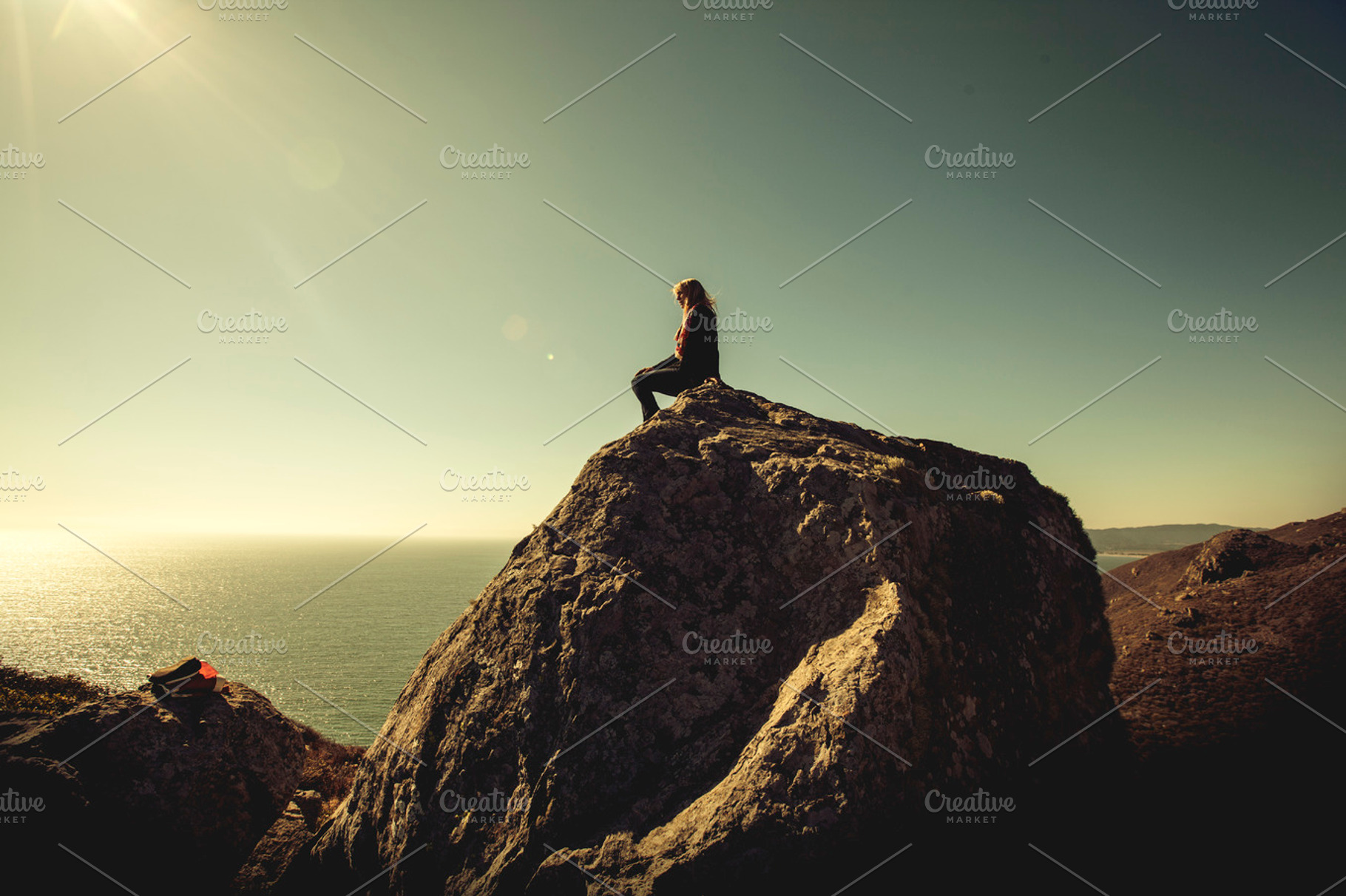 Woman on rock featuring muir woods, beach, and ocean