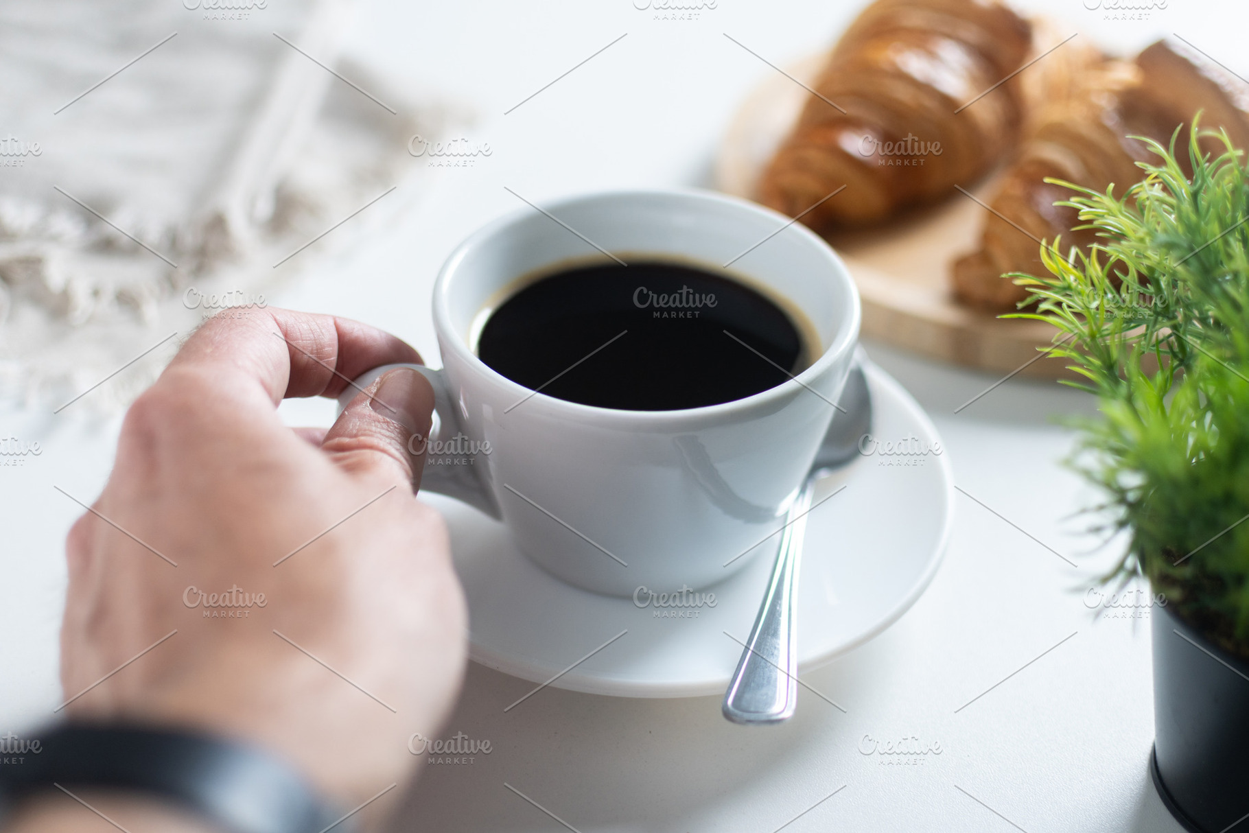 Hand Holding Cup of Black Coffee During Relaxing Breakfast at Home, a Food & Drink Photo by etorres69