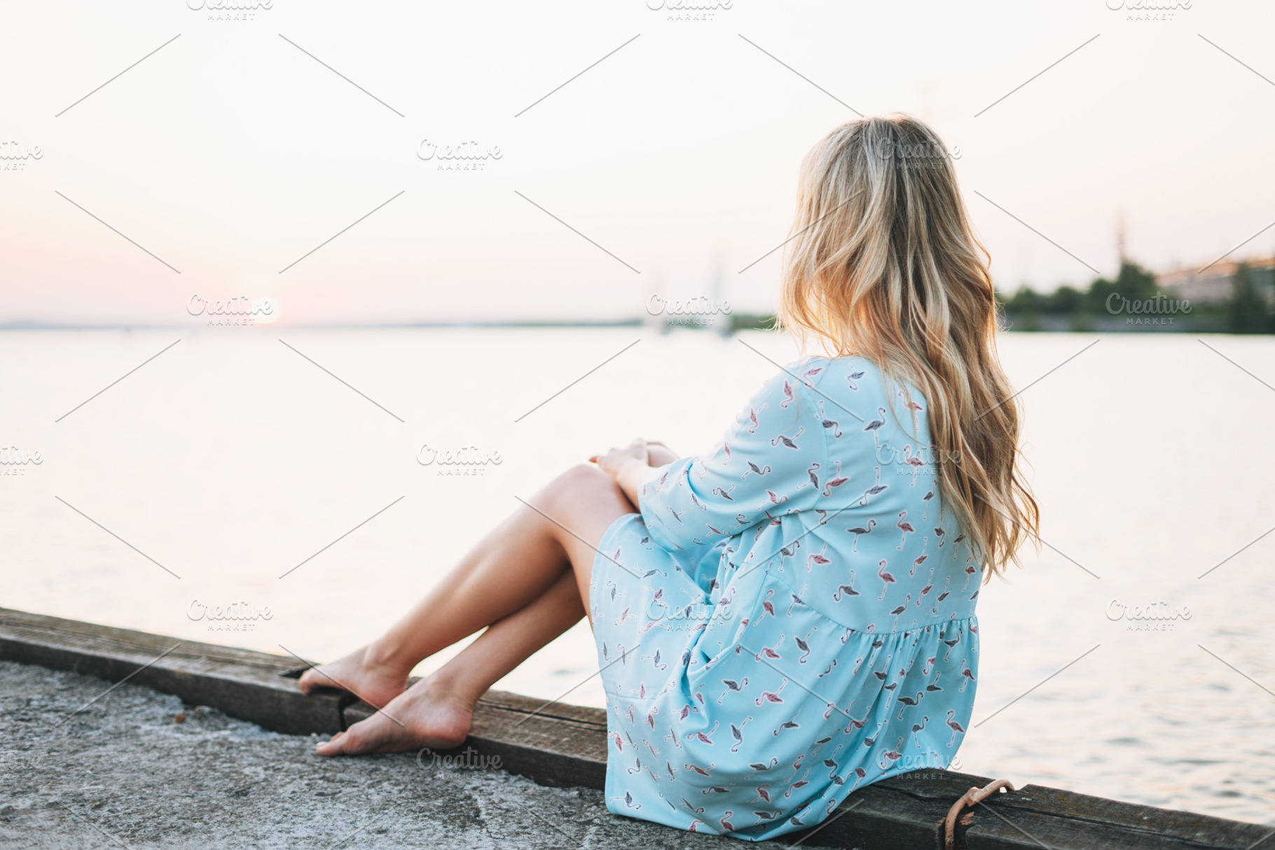 Young woman in blue dress on sunset, a Person Photo by Galina_Zhigalova