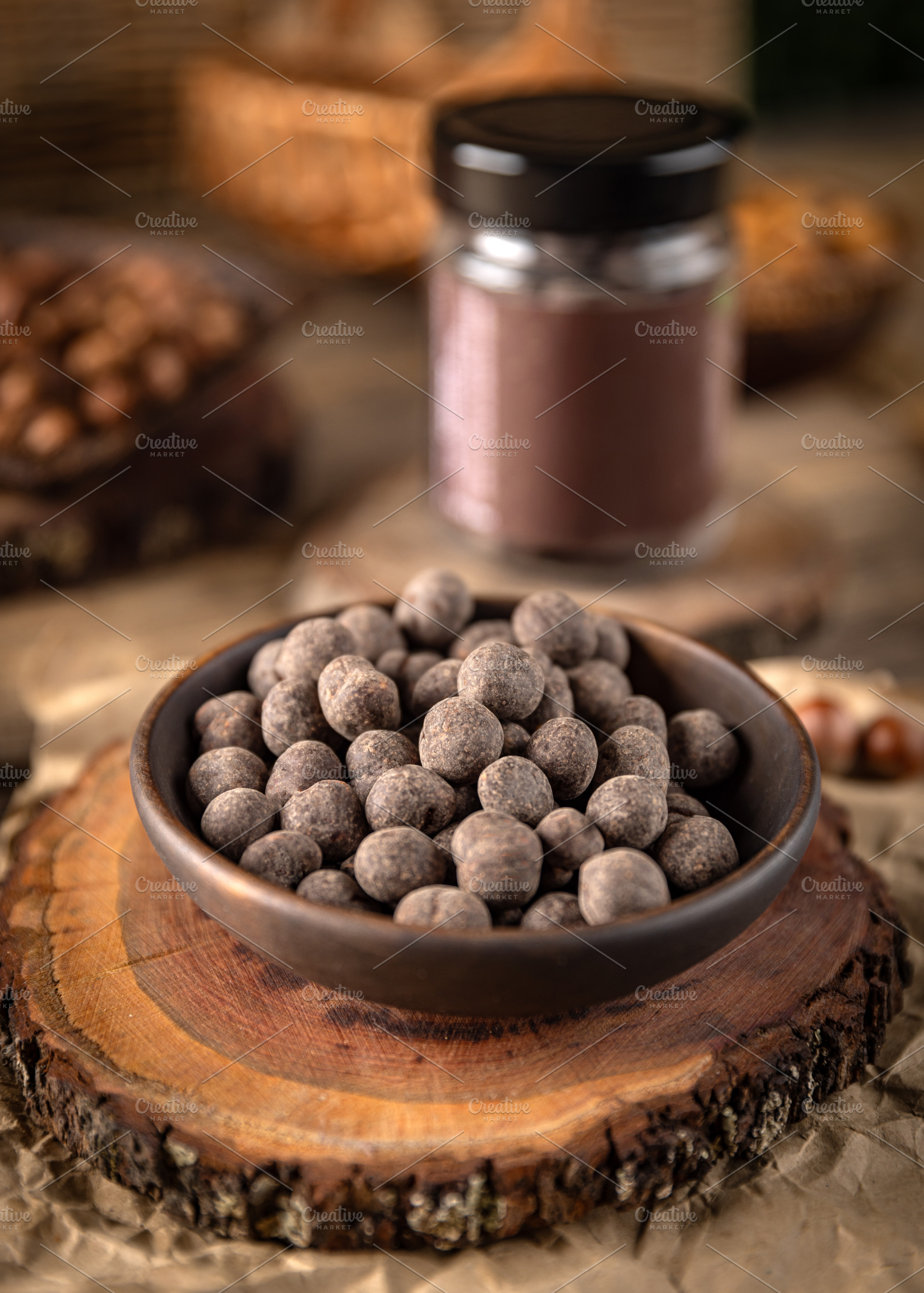 Bowl of chocolate covered hazelnuts, a Photo by Grafvision photography