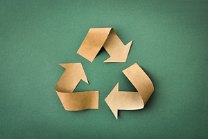 Recycling symbol made of brown paper on green textured backgroun, a Nature Photo by Davizro's Market
