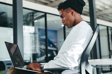 Creative businessman working on a new code in a modern office, a Person Photo by Jacob Lund