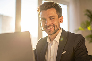 Smiling Customer Support Agent at Desk, a Business Photo by Davizro's Market