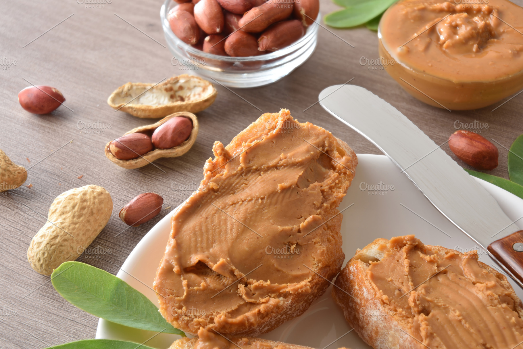 Detail of freshly sliced bread spread with peanut butter, a Food & Drink Photo by Davizro's Market