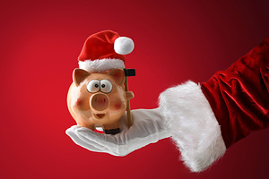 Santa Claus holding a piggy bank on red isolated background, a Person Photo by Davizro's Market