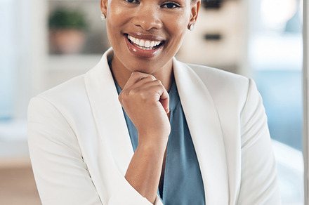 Leadership, success and portrait of a black woman in the office with a computer working on a project. Business, smile and African female corporate manager sitting at her desk with a pc in workplace., a Photo by Peopleimages.com