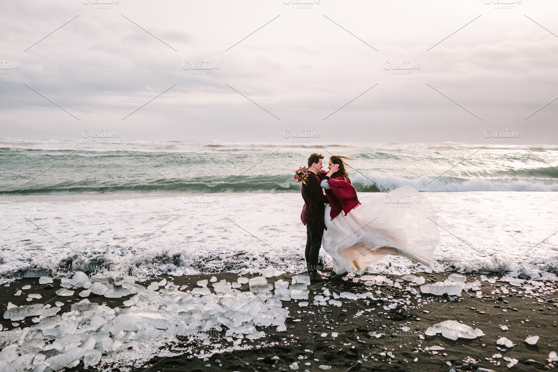 Beautiful Couple is hugging on Black Sand Beach, Iceland. Artwork, a Person Photo by Stahov