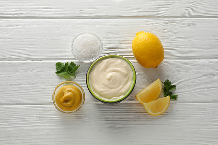 Concept of sauce, mayonnaise sauce, top view, a Food & Drink Photo by AtlasStudio