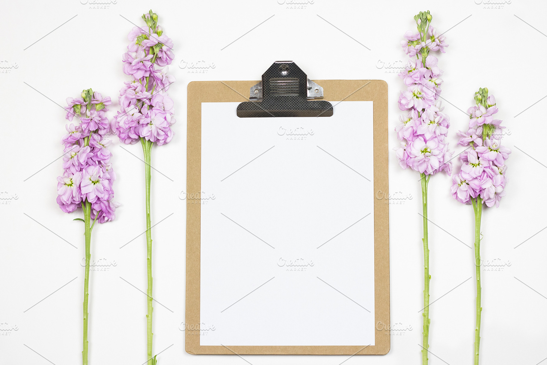 Feminine clipboard with flowers featuring flatlay, copy space, and copyspace, an Arts & Entertainment Photo by U + Me Studio