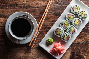 Sushi and coffee on wood, a Photo by Beautiful things