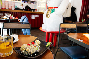 Delicious sushi meal served on a table in a Japanese restaurant interior, a Photo by AS photostudio