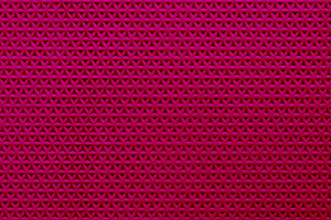 Abstract red surface with repeating triangular pattern, creating, a Background Photo by Ales Munt