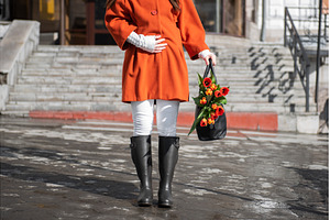 Closeup of woman in a orange coat, a Nature Photo by Jan Jack Russo Media