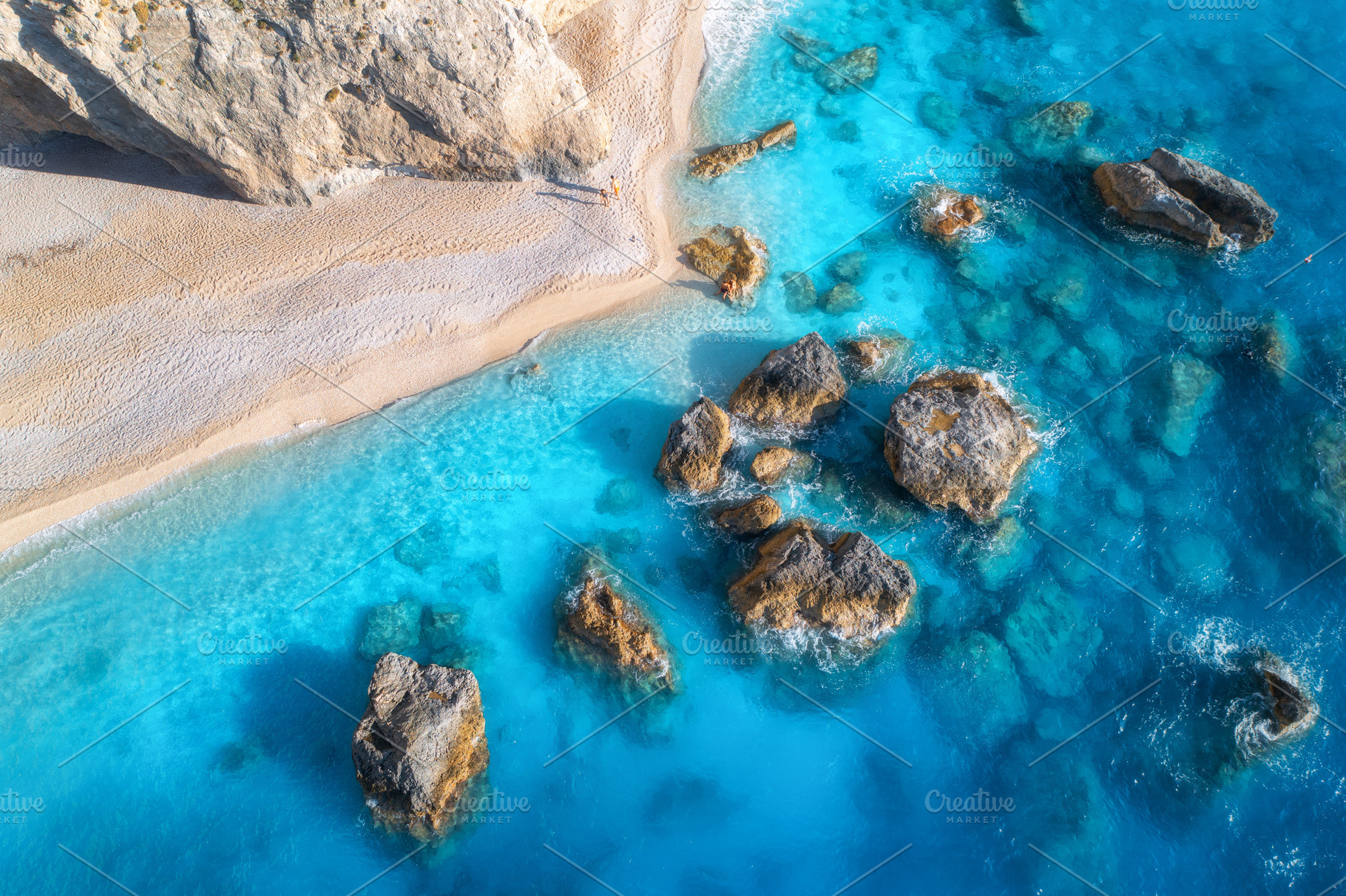 Aerial view of blue sea, rocks in clear water, white sandy beach, a Nature Photo by den-belitsky