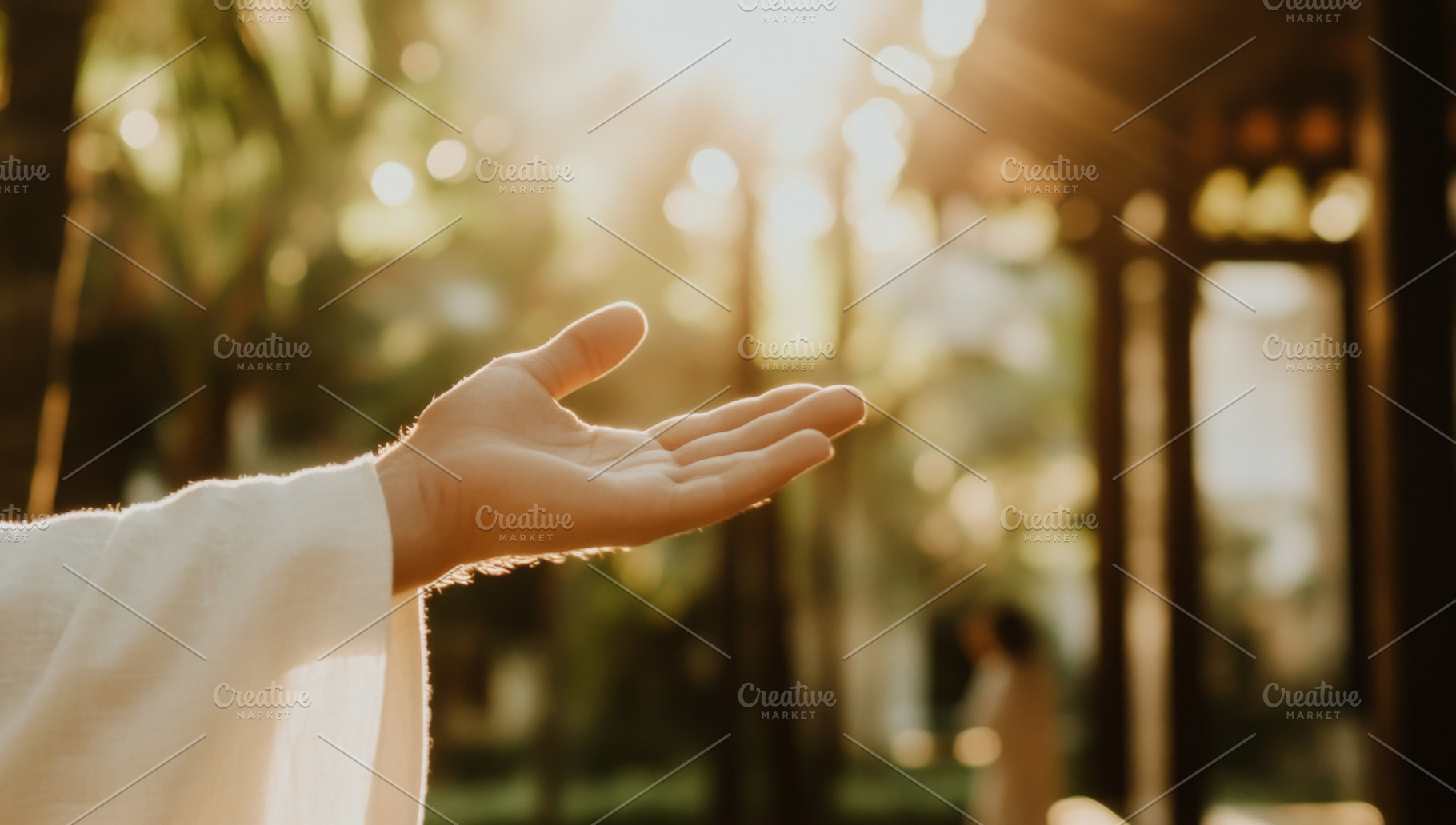Hand of Jesus reaching out with light in spiritual scene, copy s, a Photo by Dvoevnore photos