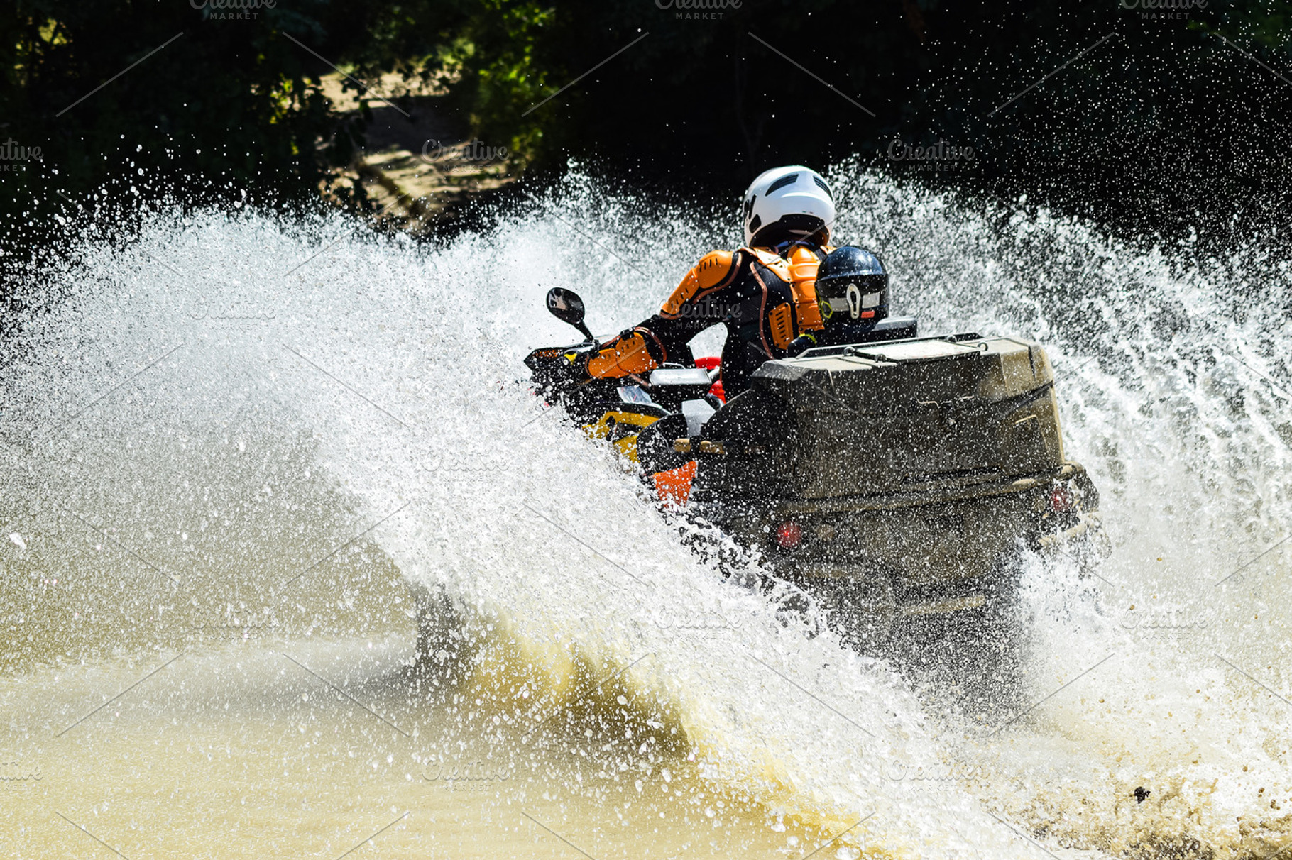The man on the atv crosses a stream tourist walks on a crosscountry terrain, a Transportation Photo by ELEONIMAGES