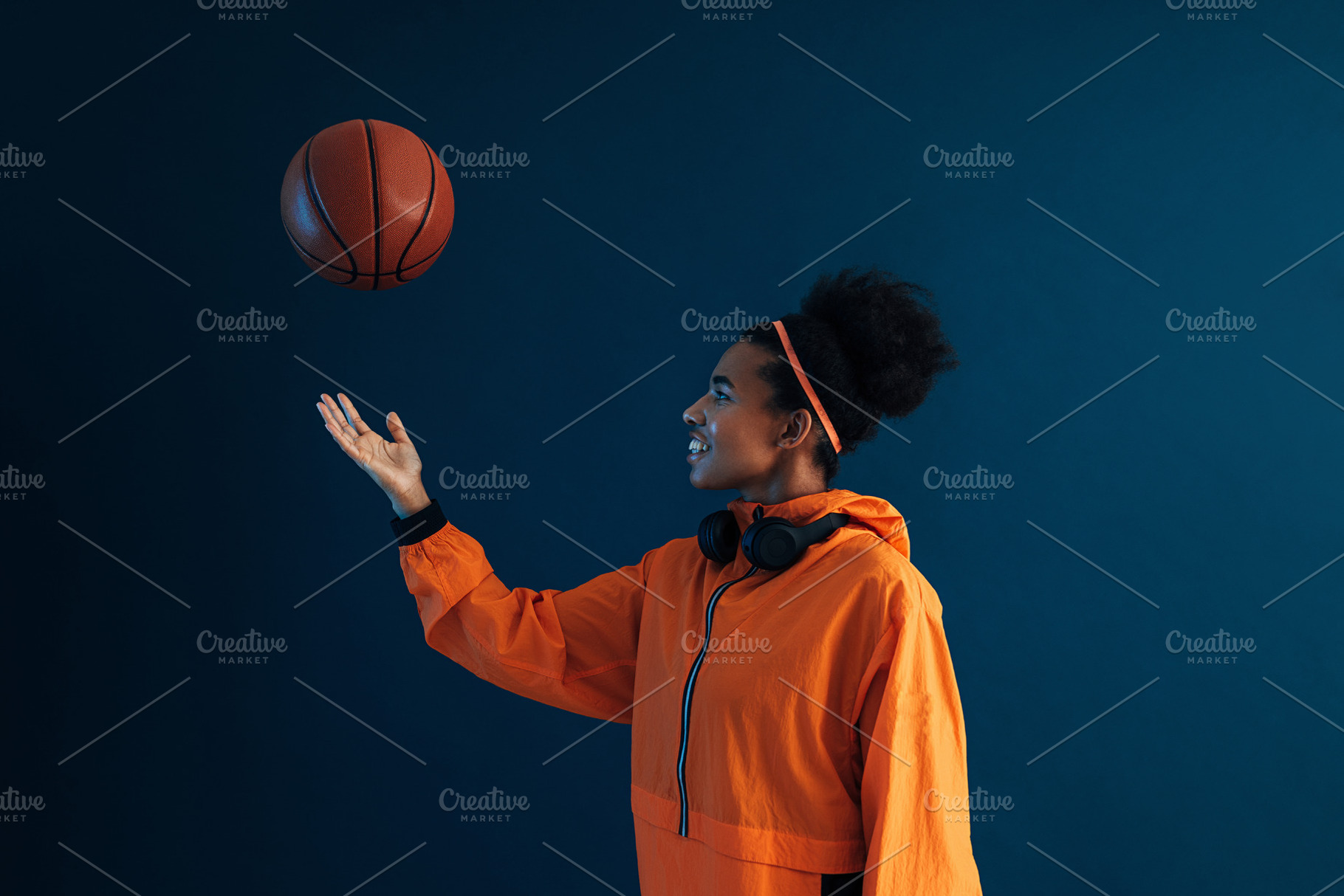 Young basketball woman tosses a ball, a Sports & Recreation Photo by Artem Varnitsin