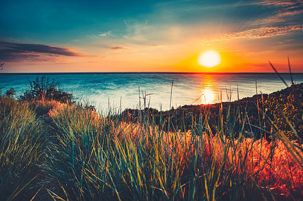 Colorful and dramatic sunset sky ocean background stock photo containing, a Nature Photo by Goinyk
