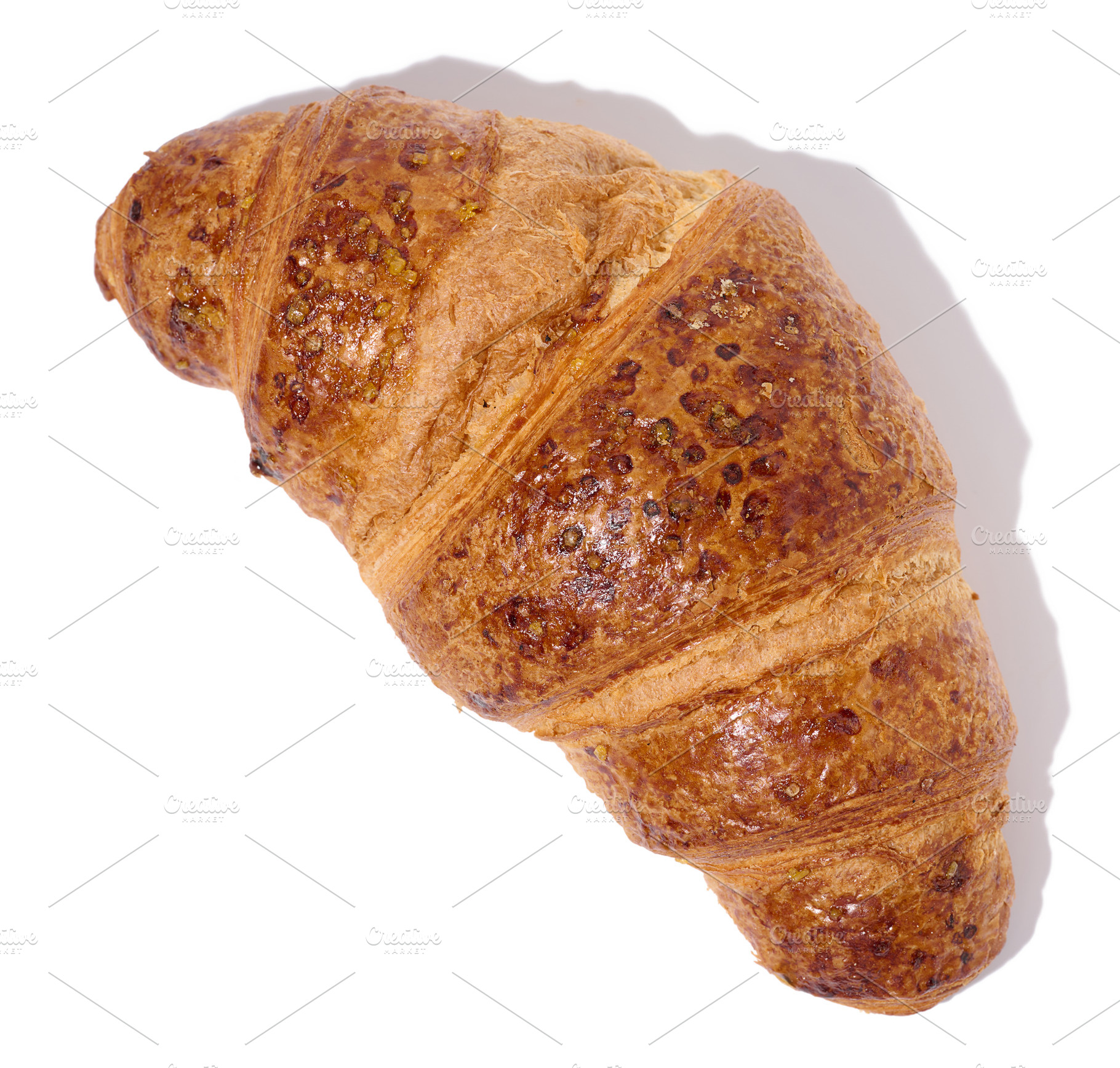 Baked croissant on a white isolated background, top view, a Food & Drink Photo by ndanko