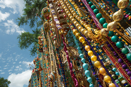 A tree covered in colorful beads and, a Photo by Iftikhar Alam