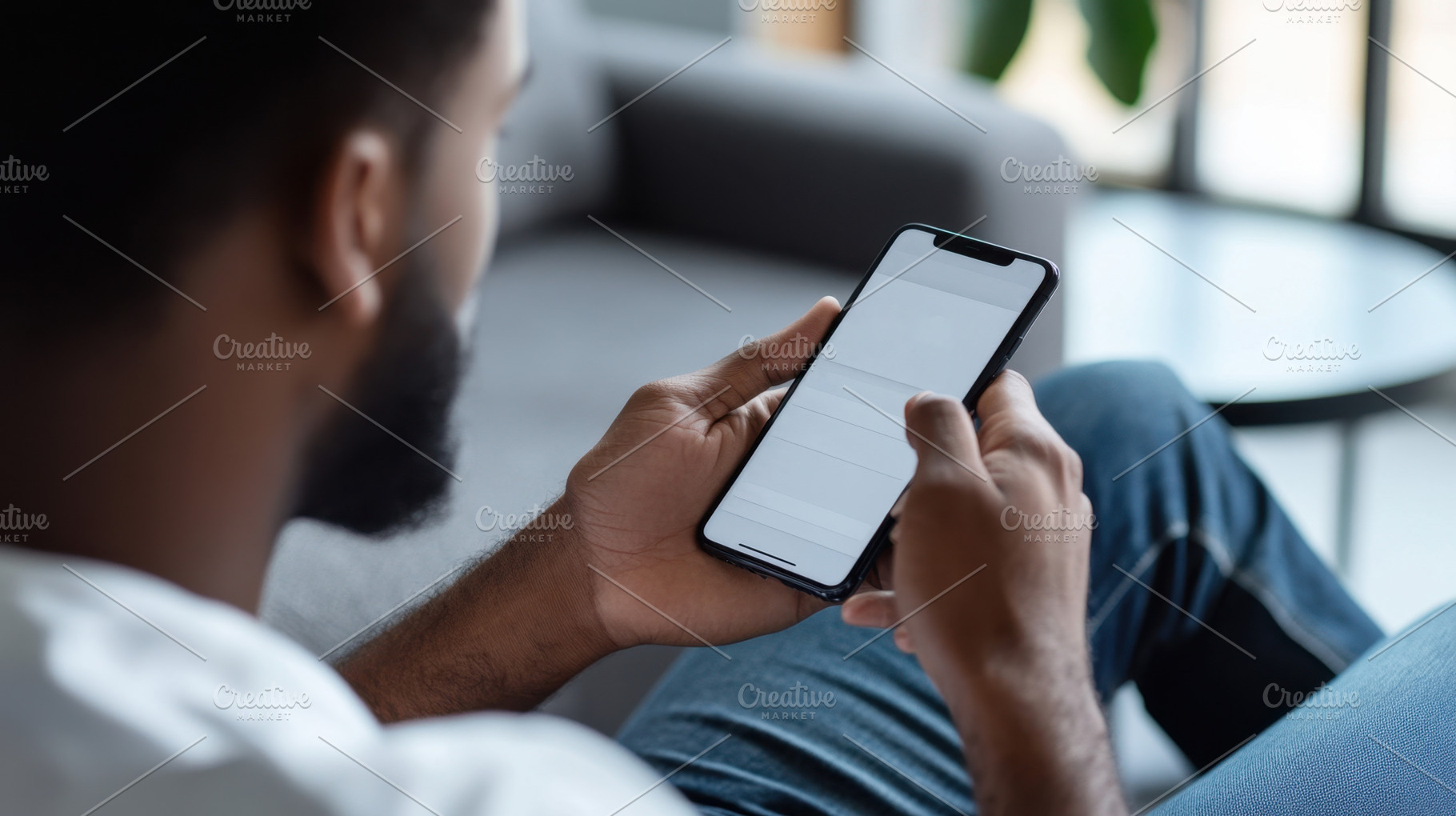 Man checks smartphone while relaxed, a Photo by Beautiful things