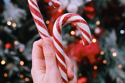 Christmas Candy cane in the hand