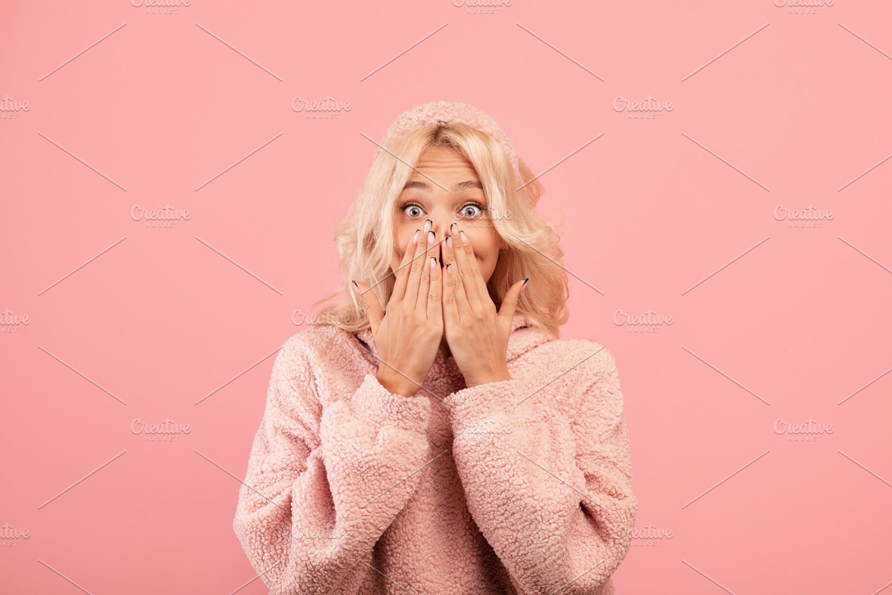 Human emotions concept. Shocked lady covering her mouth with hands and looking, a Photo by Prostock-Studio
