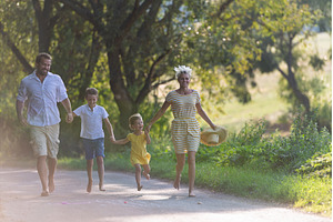 A family with small children walking, a Person Photo by HalfPoint