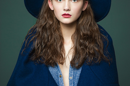 Fashion model woman coat and hat urban style pose on color background in, a Beauty & Fashion Photo by Serovphoto